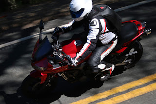 Student riding his Yamaha FZ06 into a corner