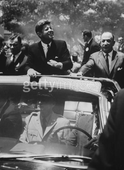 Agents (inc Kellerman) on/ near rear of car March 1963; military aide in front seat