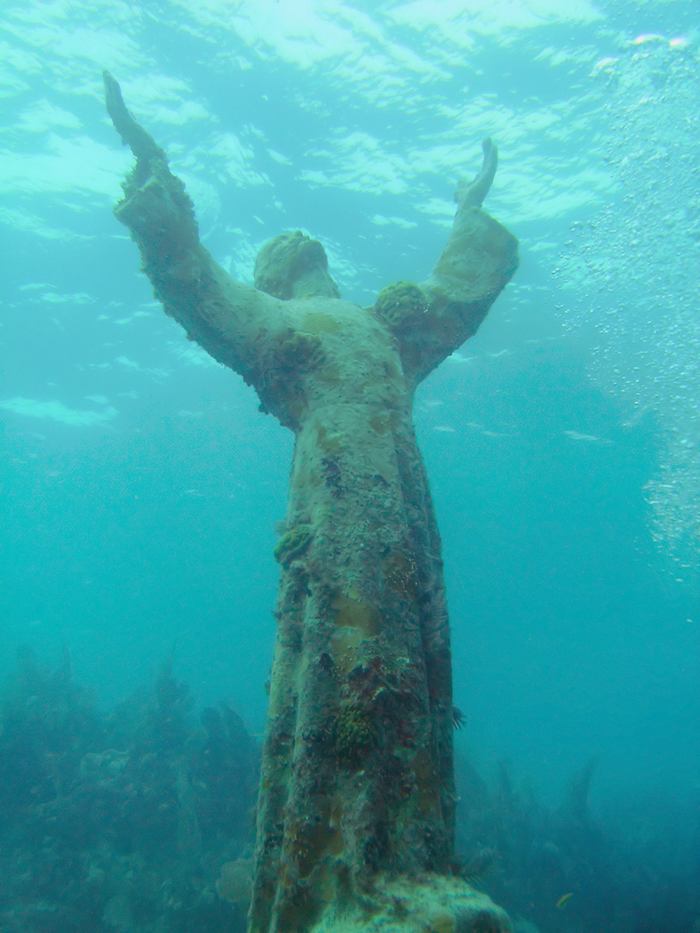 Christ of the Abyss is a submerged bronze statue of Jesus, of which the original is located in the Mediterranean Sea off San Fruttuoso between Camogli and Portofino on the Italian Riviera. It was placed in the water on 22 August 1954 at approximately 17 metres depth, and stands c. 2.5 metres tall. Various other casts of the statue are located in other places worldwide, both underwater and in churches and museums. The sculpture was created by Guido Galletti after an idea of Italian diver Duilio Marcante. The statue was placed near the spot where Dario Gonzatti, the first Italian to use SCUBA gear, died in 1947. It depicts Christ offering a blessing of peace, with his head and hands raised skyward.