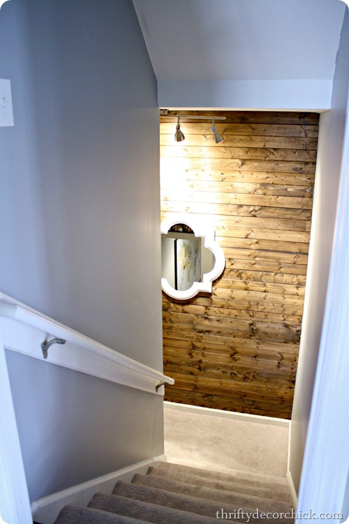 White mirror on wood planked wall