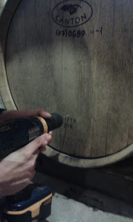 Drilling a small hole into the barrel.