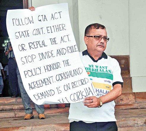 Kurseong MLA Rohit Sharma holds up a Gorkhaland poster outside the Assembly on Monda