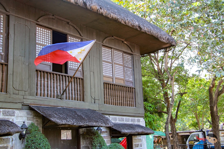 National Flag and Ancestral-looking house in Rizal Park