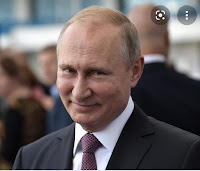 Putin grinning