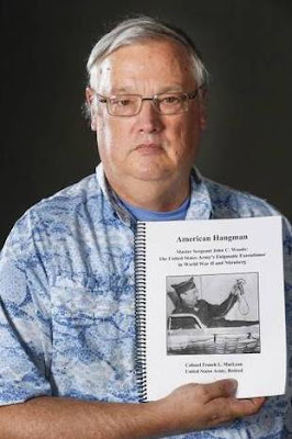 Col. (Ret.) French MacLean with a draft of his upcoming book, “American Hangman”