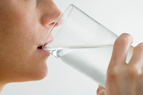 Woman Drinking Glass of Water --- Image by © Royalty-Free/Corbis