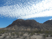 Mesa De Anguila rises up in west Big Bend, far from the reaches of the rest .