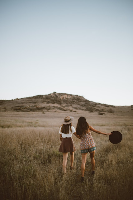 friends hiking in countryside, unsplash.com