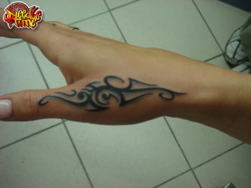 small hand tattoos. hand tattoos for women.