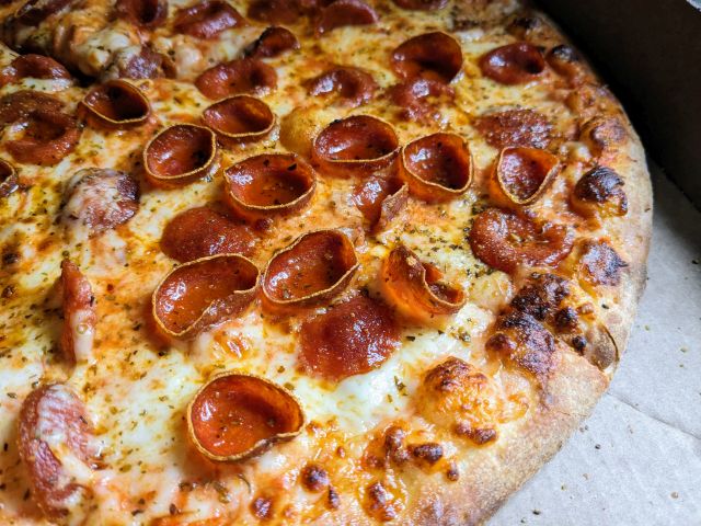 Close-up of Papa Johns Crispy Cuppy 'Roni Pizza.