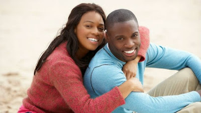 happy-black-couple-in-the-sand