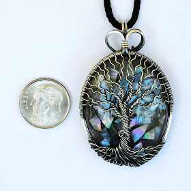 Coin Size Compare: Silver Tree of Life Necklace Pendant With Glow in the Dark Mother of Pearl Orgonite