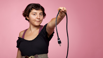 lady holding a cable unplugged