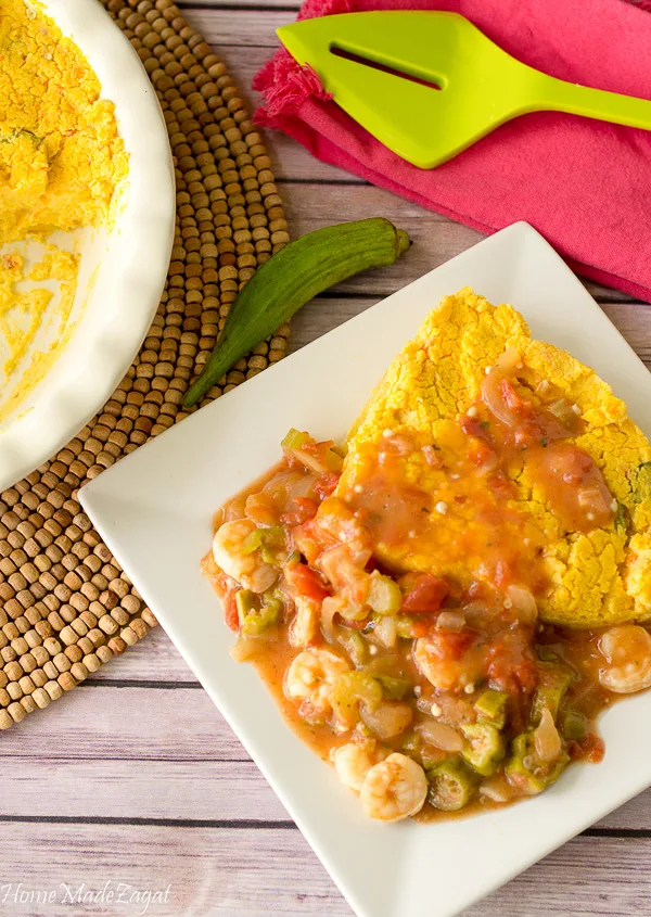 A plate of coo coo paired with creole shrimp with ochro.