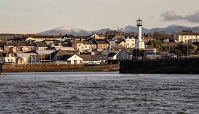 Photo of Maryport from the Solway Firth with a dusting of snow on the distant fells