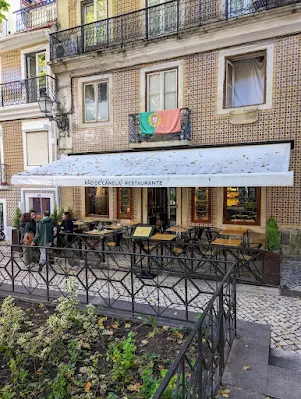 Patio and awning of Pao de Canela restaurant in Lisbon