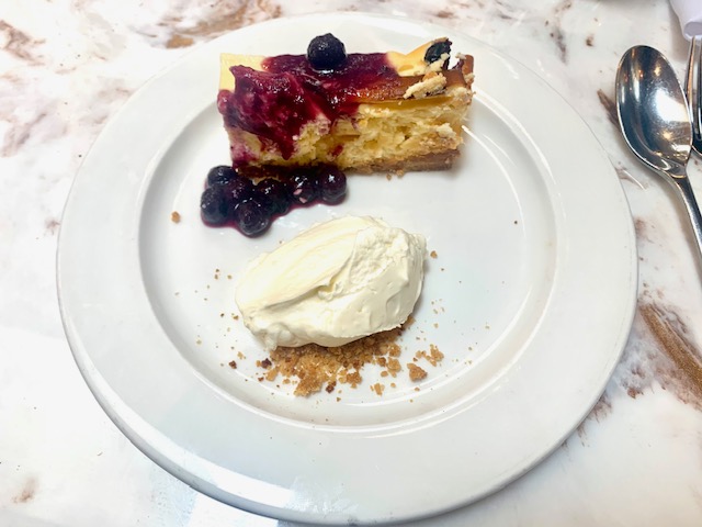 Baked blueberry cheesecake with blueberry compote and creme fraiche