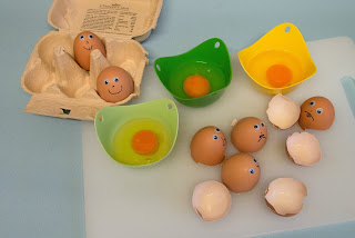 Eggs with googly eyes and drawn on noses and mouths--some happy, some sad, some eggs broken and poured into bowls