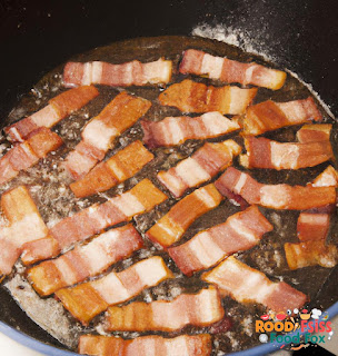 Image of bacon frying in a pan