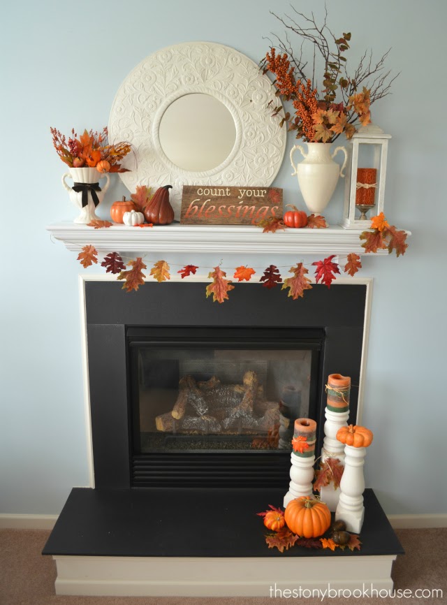 Fireplace and mantel all decorated for fall