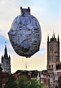 The Castle of Vooruit . heliumfilled balloon floating above the ground at a . (the castle of vooruit ahmetogut)