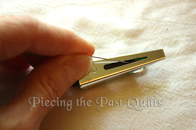 Take your straight pin and push the fabric toward the small end until it exits the tube.