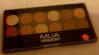 black eyeshadhow palette with 12 shades of brown, cream and orange gold