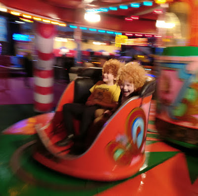 My 2 boys on the Winter Wonderland Waltzers ride in Manchester