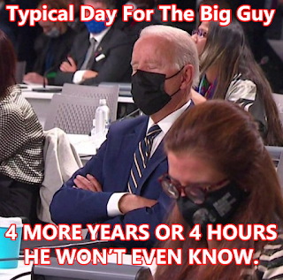 Meme by Randy Dreammaker, of Joe Biden falling asleep with his arms crossed and wearing a black face mask. Top of the meme says, "Typical day for the big guy". Bottom of the meme says, "4 more years or 4 more hours, he won't even know".