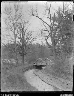 Mill race at low water. Sluice gate may be closed, or dry spell in the weather.