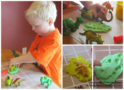 making prints and tracks in play-doh with toy dinosaurs