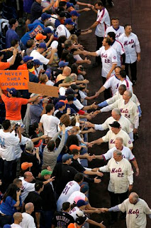 Some of the Mets greatest players shake hands with the fans