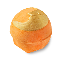 A spherical red bath bomb with yellow moon presents engraved into it on a bright background