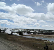 The road leading to the south end of Yellowstone Park was barricaded at Old . (road old faithful )