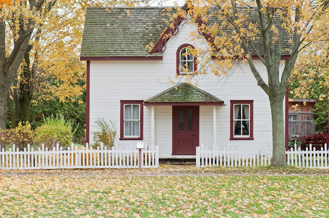 Pretty house behind a white picket fence