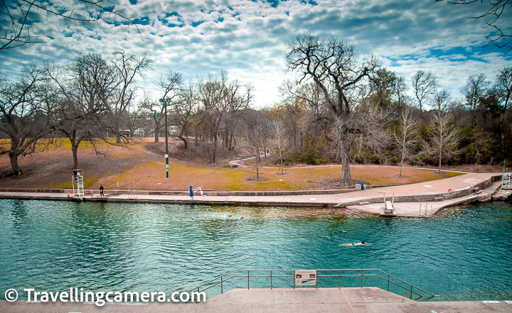 In last blogpost, we shared about Zilker Park of Austin and today we are sharing about a close-by place which is mainly popular amongst locals but worth walking by. It's a place called Barton Springs Pool, which is a recreational outdoor swimming pool filled entirely with water from nearby natural springs. It is located on the grounds of Zilker Park in Austin, Texas. The pool exists within the channel of Barton Creek and utilises water from Main Barton Spring, the fourth largest spring in Texas. The pool is a popular venue for year-round swimming.