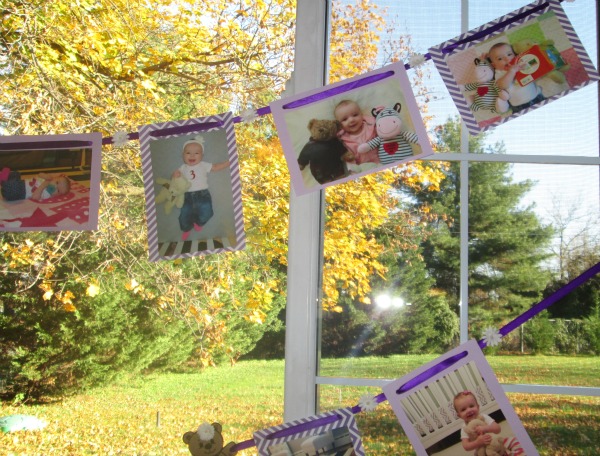 using monthly baby pictures to make a photo banner for a first birthday party