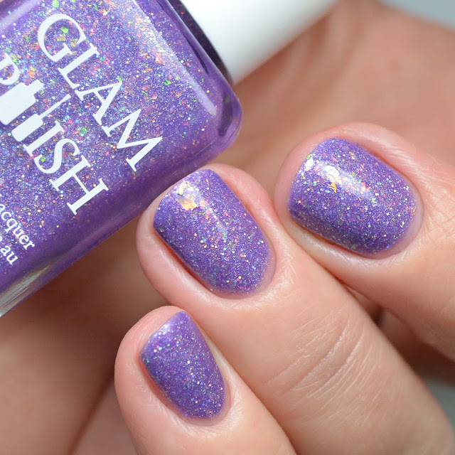 purple nail polish with flakies swatched
