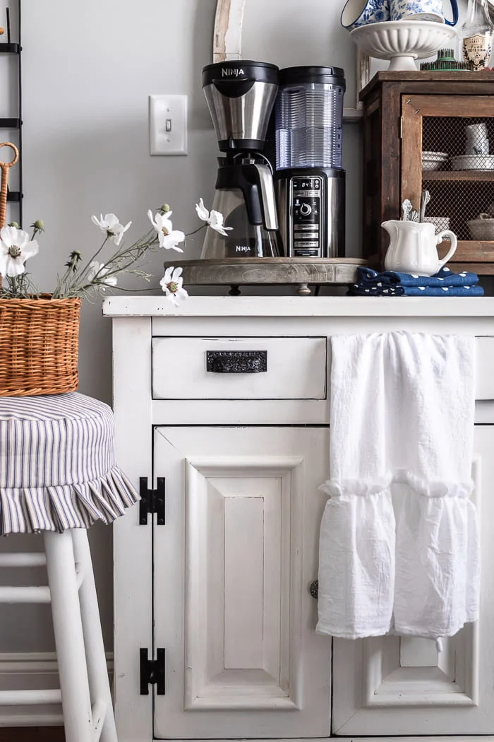 white ruffled flour sack towel, white coffee bar, ruffled stool