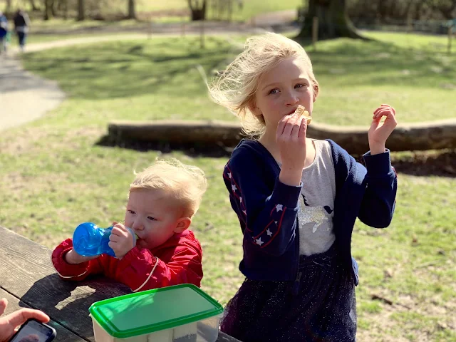 sisters eating a packed lunch at the stickman trail