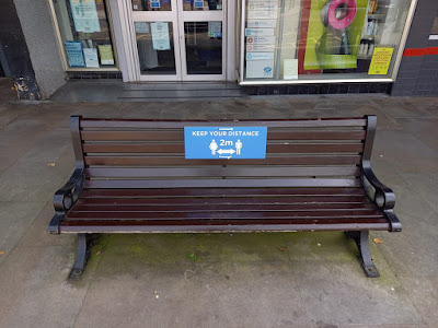 A social distancing sign on a bench in Colne, Lancashire