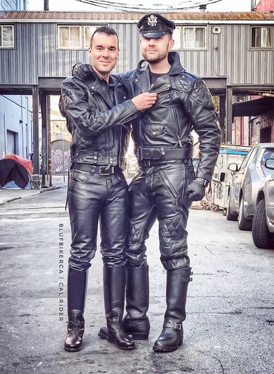 Two Leatherman standing outside in full gear
