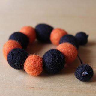 Orange felted bracelet