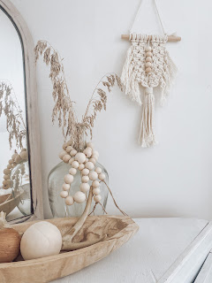 wood bead garland on a jar for boho home decor