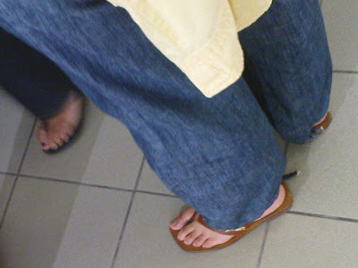 Mature feet in jeans