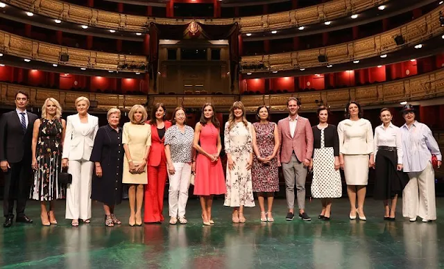 Queen Letizia wore a fuchsia fit and flare sleeveless bespoke dress by Carolina Herrera. Brigitte Macron, Begoña Gomez