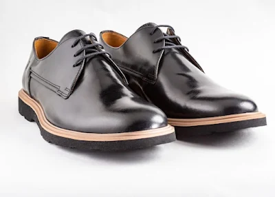 A Pair of Glossy Black Leather Shoes