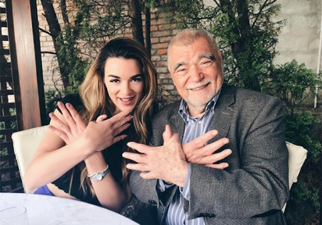 Stipe Mesic and Albanian model performs Albanian symbol of two-headed eagle