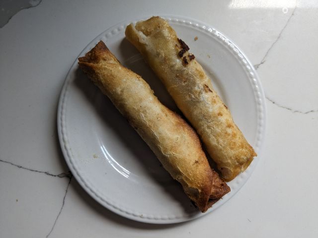 Two Kroger Carne Guisada Flautas on a plate.