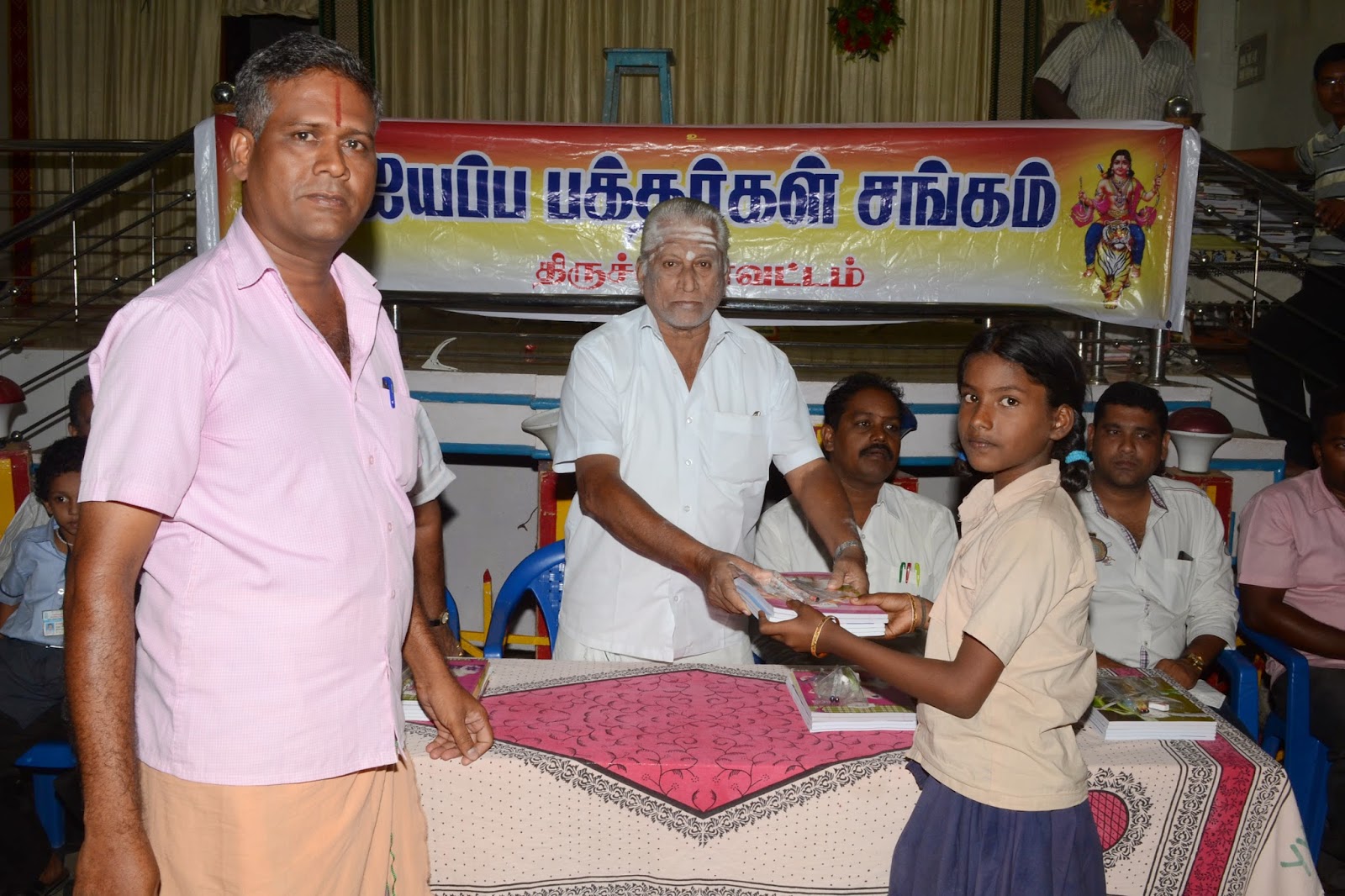 Distribution of free note-books to school children from Government aided schools in around Srirangam on 23.06.2014 at Yoga Kalyana Mandapam, Srirangam.